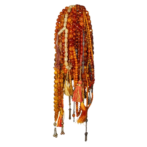 102 - A large group of reconstituted amber and other prayer bead necklacesProperty of a nobleman... 