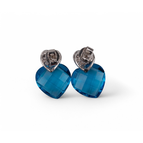 109 - Contemporary, A pair of 18k white gold topaz and diamond earrings each designed as a double heart. T... 