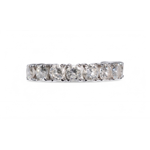 61 - 1990sA diamond half hoop ring, set to the front with ten brilliant cut diamonds claw set in 18k whit... 