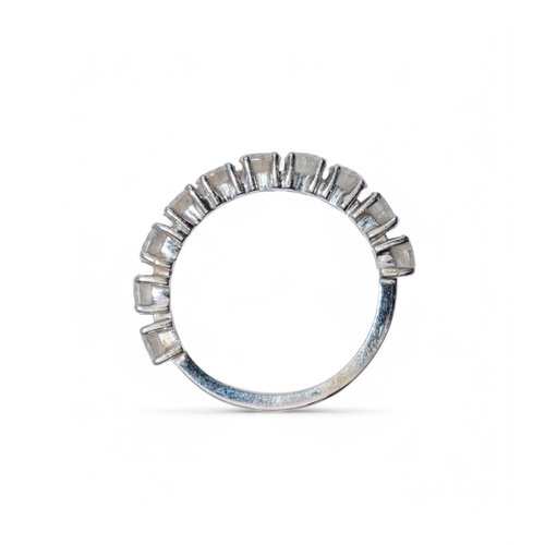 61 - 1990sA diamond half hoop ring, set to the front with ten brilliant cut diamonds claw set in 18k whit... 