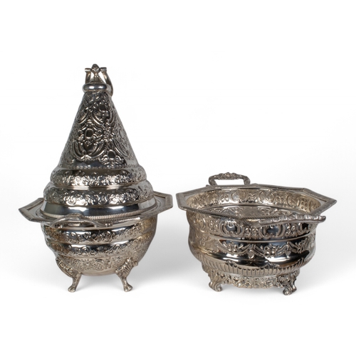 171 - Two white metal/silver (?) embossed covered bowls on four legs with one cone-shaped topWith Arabic m... 