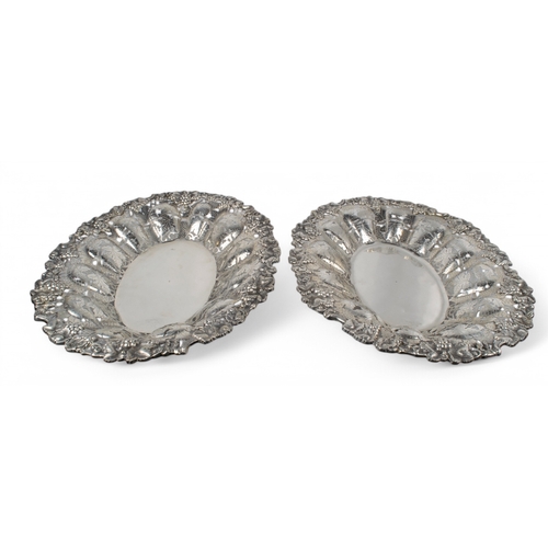 172 - A pair of silver pierced dishes with foliate vine decorationsHallmarked '900' Property of a nob... 