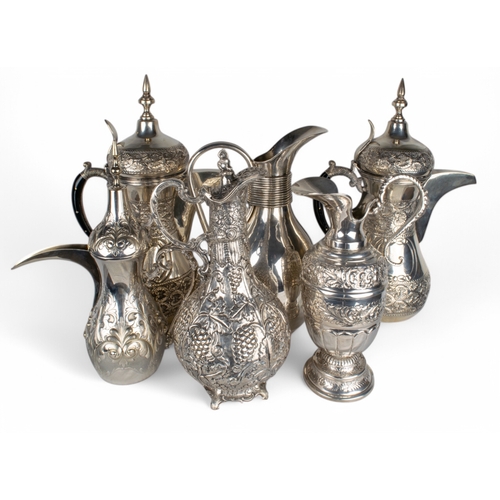 175 - 6 silver coffee pots and ewers[a] An Islamic style coffee pot with 800 mark to base and marked 'fita... 