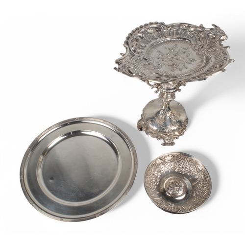 187 - A mixed lotTo include:[a] Turkish (?), white metal/silver (?) tazza[b] A silver ribbon and floral re... 