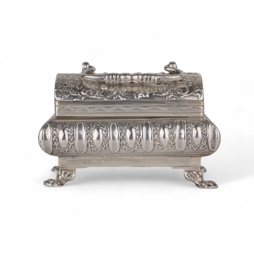 199 - DutchA small silver casket on four feet with a handle and embossed with festive decorations.Weight:A... 