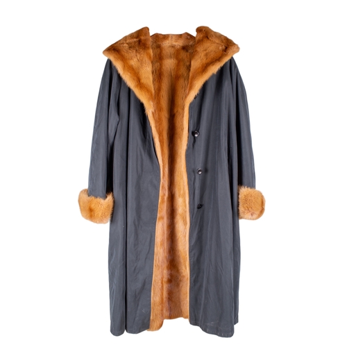 205 - Enrico MandelliA custom vintage mink-lined black raincoat, with red glow mink cuffs and collar... 