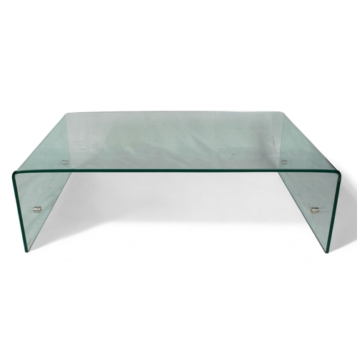 241 - ContemporaryA shaped glass low coffee tableWith stainless steel fittingsDimensions:14 in. (H) x 43.2... 