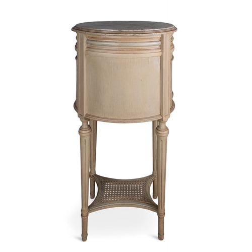 253 - Louis XV styleA hand-painted bedside table with marble topOn fluted legs, with wicker to the side an... 