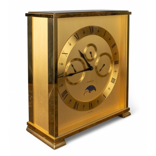 257 - Tiffany & CoClock with day date gilt metalWith Investcorp inscription to the topTogether with a&... 