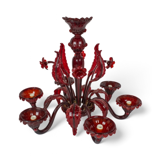 262 - 20th century, MuranoA red chandelier with floral inserts and six wired lightsTogether with an extra ... 