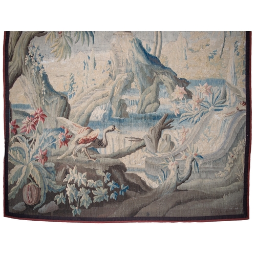 295 - FrenchEarly 18th CenturyA large verdure chinoiserie Aubusson tapestryWith an exotic bird in a river ... 