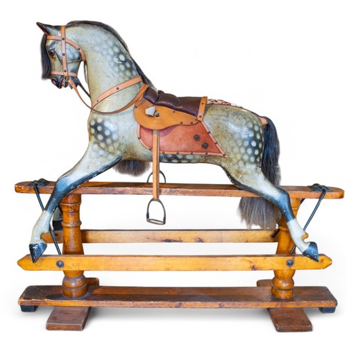 283 - F.H. Ayres, Circa 1920A large side saddle rocking horse with its tongue sticking out. With side sadd... 