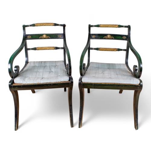 300 - RegencyA pair of painted and gilded elbow chairsThe backs with a centre rail applied with brass moti... 