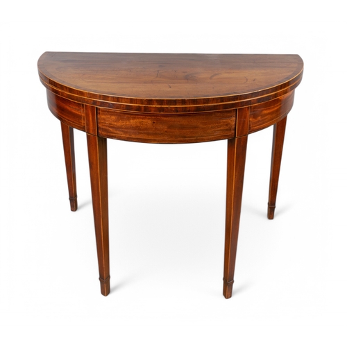 320 - EnglishGeorge IIIA demi-lune folding table in mahogany with satinwood cross banding, Sheraton design... 