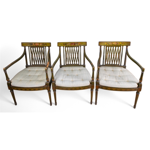 321 - George IIIA set of three Sheraton period painted elbow chairsThe square backs with floral painted to... 