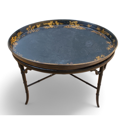 326 - Three black lacquered papier-mâché occasional tables with painted and gilded ornament[a] One of rect... 