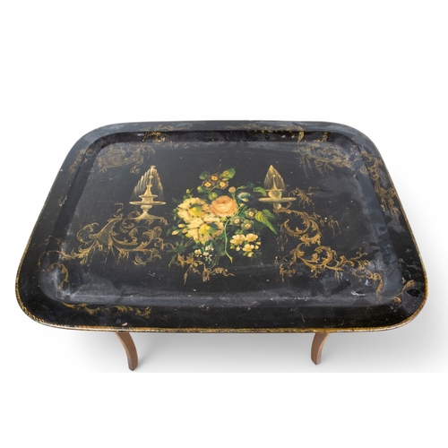 326 - Three black lacquered papier-mâché occasional tables with painted and gilded ornament[a] One of rect... 