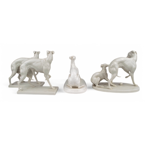 335 - AntiqueA set of four porcelain Italian Greyhounds[a] An Italian Greyhound stretching, stamped and si... 