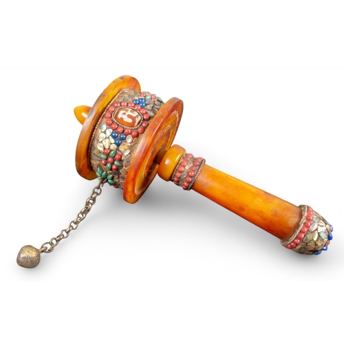 601 - TibetanAn amber and gem set handheld prayer wheel