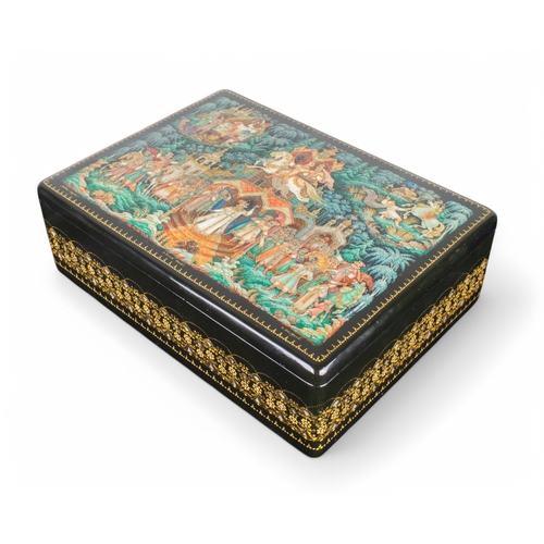 671 - RussianContemporaryA Kholui lacquer box. The lid decorated with hand-painted scenes from Sivko-Burka... 