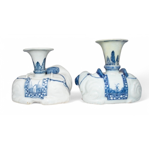 706 - Chinese, 18th centuryTwo blue and white vases, designed as recumbent elephants. (As found)Dimensions... 