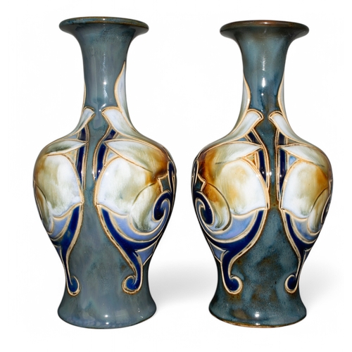 713 - To include:[a] Circa 1900sA pair of Frank A Butler Royal Doulton vases, with flower decorations glaz... 