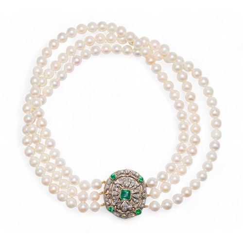 63 - 20th centuryA three row culture pearl choker necklace to a Victorian style emerald and diamond oval ... 