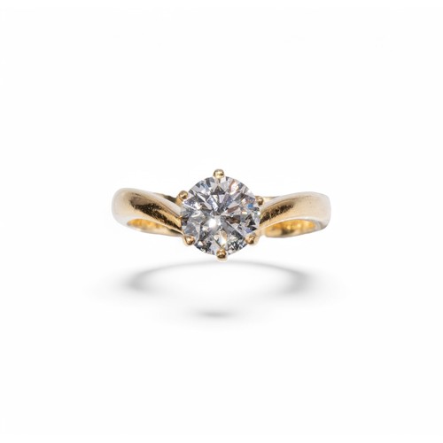 64 - 1990sA fine brilliant cut diamond single stone ring, claw set in yellow gold.The circular shaped dia... 