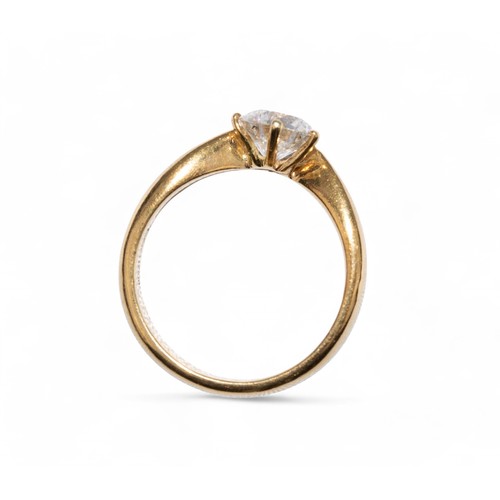 64 - 1990sA fine brilliant cut diamond single stone ring, claw set in yellow gold.The circular shaped dia... 