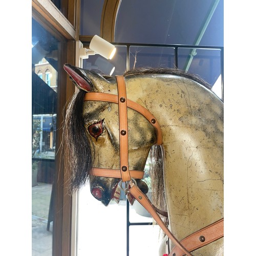 283 - F.H. Ayres, Circa 1920A large side saddle rocking horse with its tongue sticking out. With side sadd... 