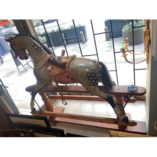 283 - F.H. Ayres, Circa 1920A large side saddle rocking horse with its tongue sticking out. With side sadd... 