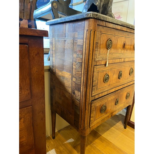 226 - French18th centuryA parquetry inlaid petite chest of drawers, with marble top above three drawers wi... 