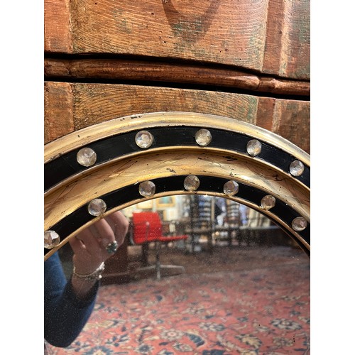 316 - IrishGeorgianAn oval wall mirrorThe ebonies and gilded frame studded with glass beadsFrom the Fane C... 