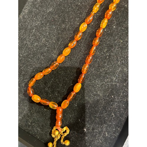 75 - A group of seven various butterscotch amber and amber prayer bead necklacesProperty of a noblemanTot... 