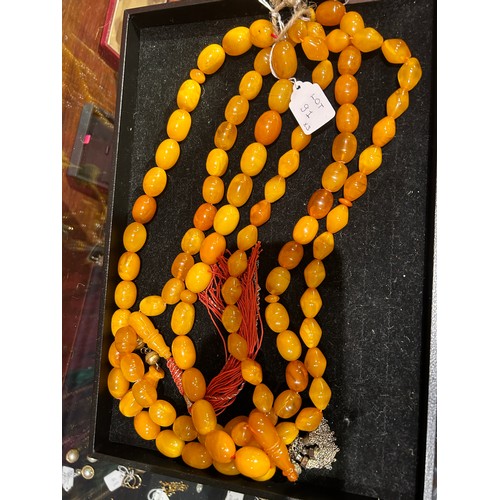 91 - A group of three butterscotch amber prayer bead necklacesProperty of a noblemanTotal weight: Approx.... 