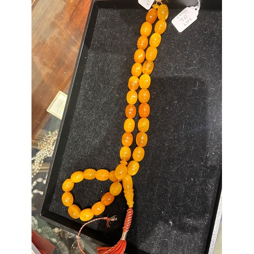 91 - A group of three butterscotch amber prayer bead necklacesProperty of a noblemanTotal weight: Approx.... 