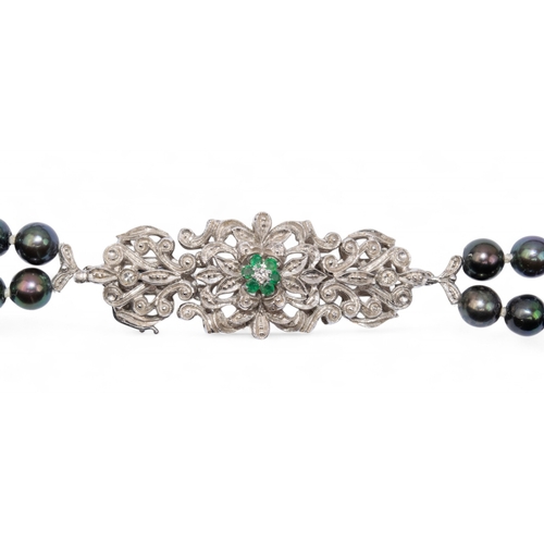 65 - Continental, 1980sA two-row black coloured cultured pearl necklace. The pearls measuring 2.68mm. Wit... 