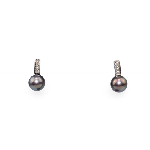 73 - Circa 1990sA pair of Tahitian black cultured pearl and diamond earrings. Each set with a Tahitian pe... 