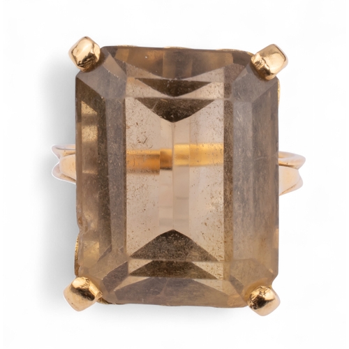 74 - Circa 1950sA smoky quartz yellow gold dress ring. The rectangular-shaped cut-cornered smoky quartz s... 