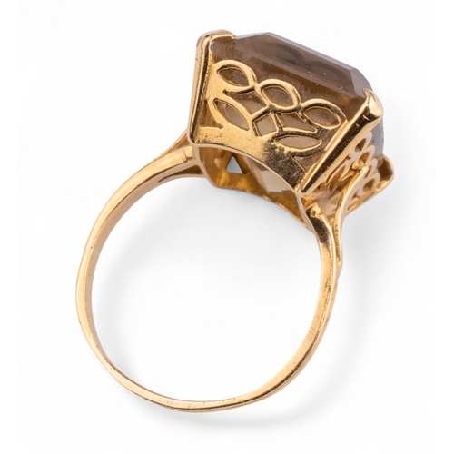 74 - Circa 1950sA smoky quartz yellow gold dress ring. The rectangular-shaped cut-cornered smoky quartz s... 