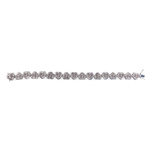 111 - Continental, ContemporaryAn 18k white gold diamond heart-shaped sectioned bracelet, composed of seve... 