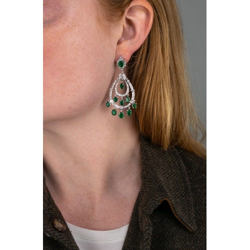 60 - ContemporaryA pair of emerald and diamond pendant earrings, composed of two-row drops with nine flex... 