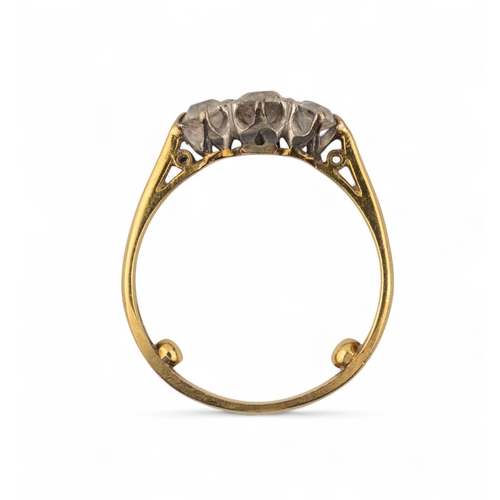1 - British, circa 1960sAn 18k gold and graduated three-stone diamond ringTotal weight:Approx. 3.7 g.Fin... 