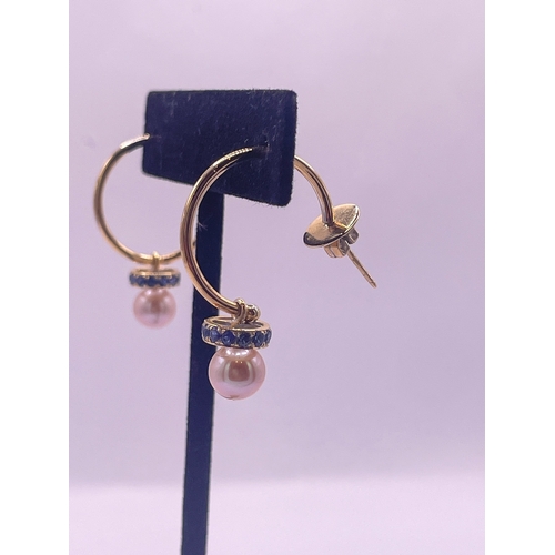 28 - A pair of 18 carat gold, sapphire, and cultured pearl hoop earringsWeight: 5.01 grams approximately... 