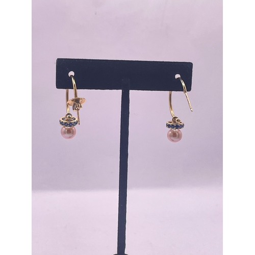 28 - A pair of 18 carat gold, sapphire, and cultured pearl hoop earringsWeight: 5.01 grams approximately... 