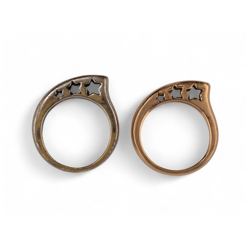 31 - A pair of 18k gold and silver-coloured metal ringsDesigned as a plain hoop with graduated pierced st... 