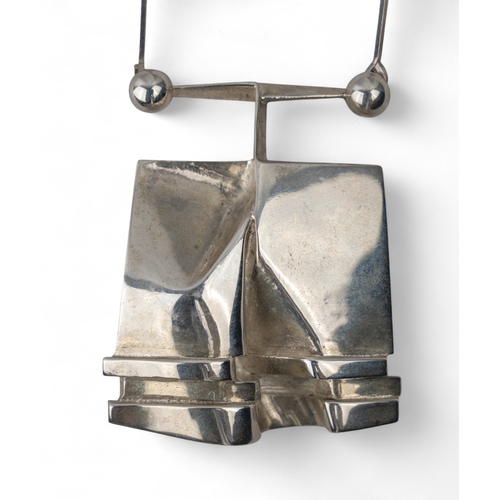 45 - Finnish, 1970sA silver Bj&ouml;rn Weckstr&ouml;m abstract pendant on a bar-chain back.Total weight: ... 