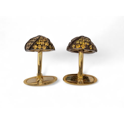 52 - A pair of yellow sapphire, yellow gold and silver cufflinksWith bar clip backsTotal weight: Approx. ... 