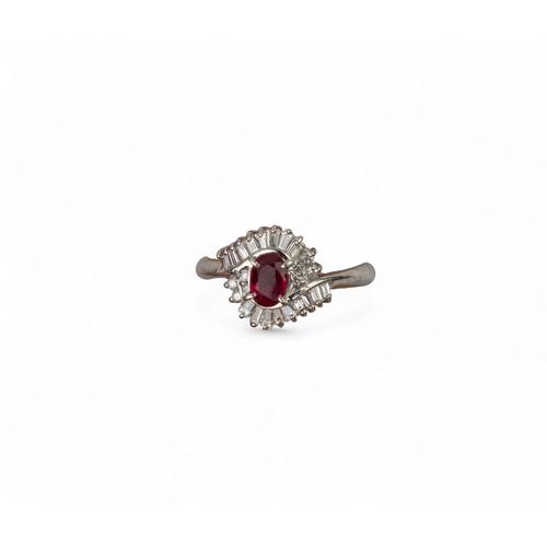 60 - A pretty ruby and diamond cluster ringThe oval-shaped ruby weighing 0.51 cts. Within a surround of b... 