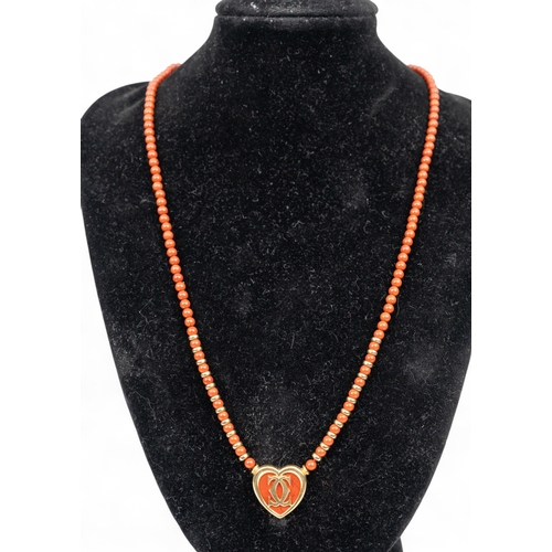 7 - CartierA heart-shaped yellow gold and jasper necklace. The heart-shaped centre set with jasper backg... 